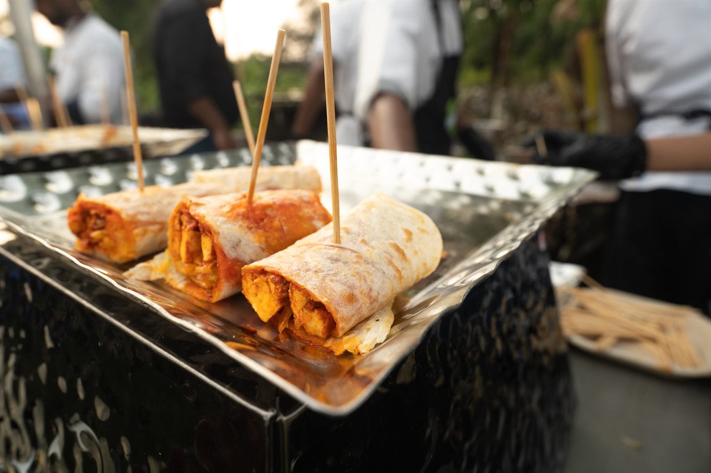 Jackfruit rolls being assembled on the live counter